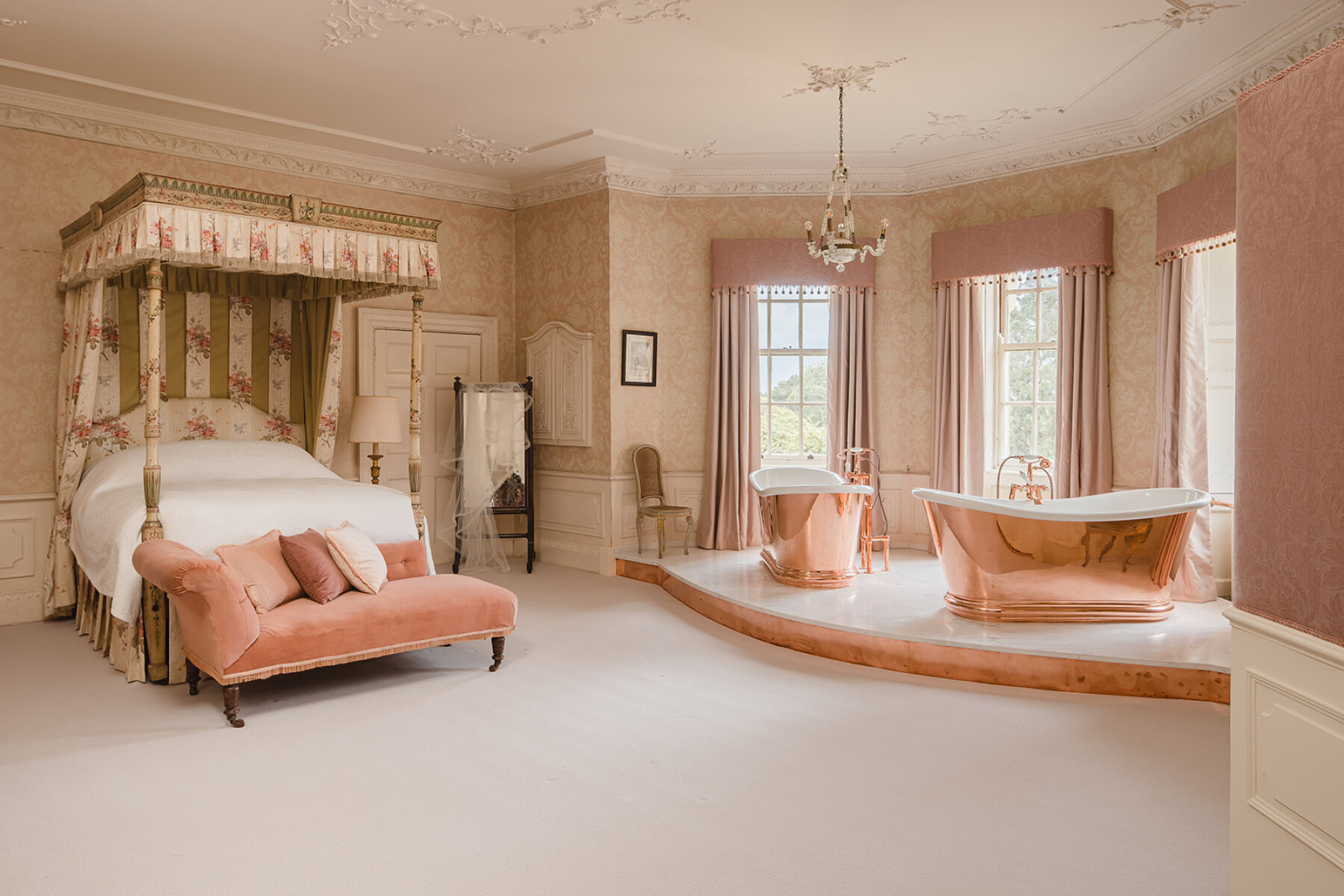 Luxurious bridal suite featuring a canopy bed, elegant bathtub, and soft pastel decor, perfect for pre-wedding moments.